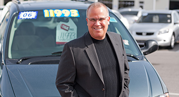 Man standing by black car